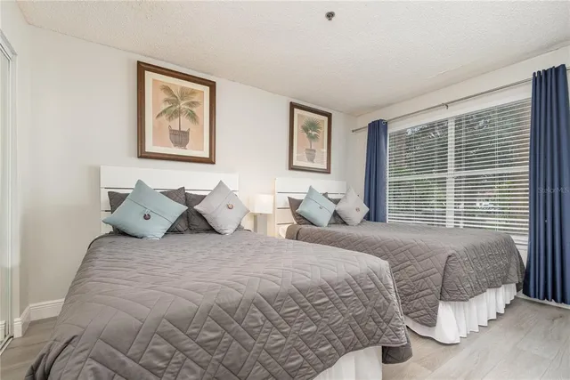 a bedroom with bed and a window