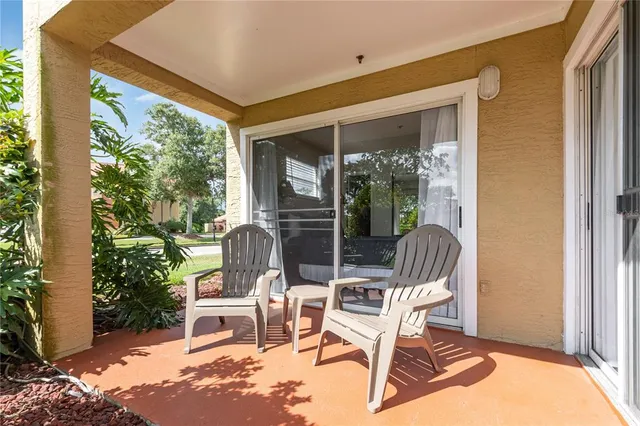 a view of a two chairs in the balcony