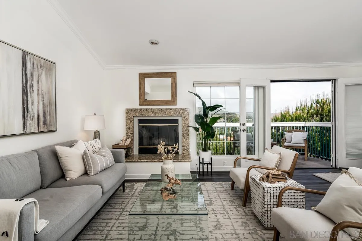 16470 Avenida Venusto, Unit F Rancho Bernardo, CA 92128 - Photo 1 of 30 a living room with furniture and a fireplace