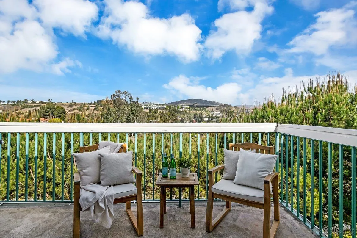 16470 Avenida Venusto, Unit F Rancho Bernardo, CA 92128 - Photo 15 of 30 a view of a chair and table