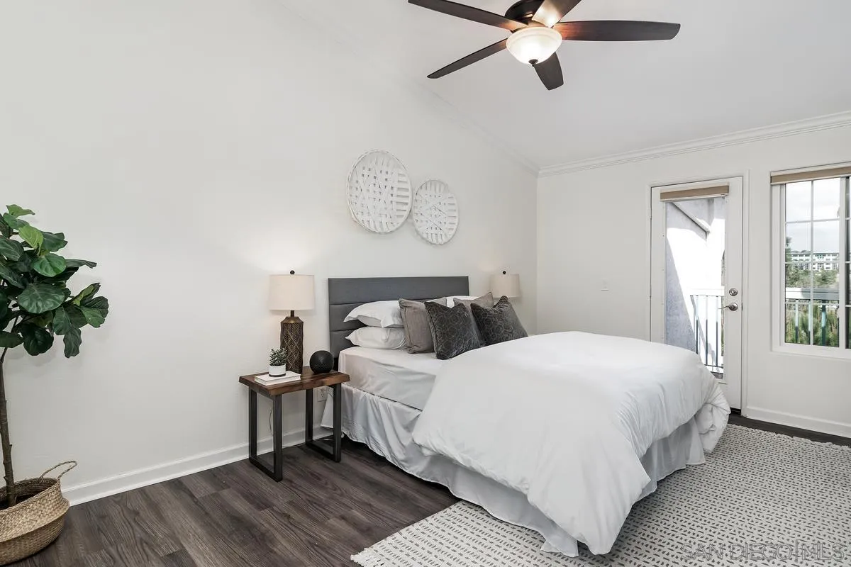 16470 Avenida Venusto, Unit F Rancho Bernardo, CA 92128 - Photo 17 of 30 a bedroom with a bed and a window
