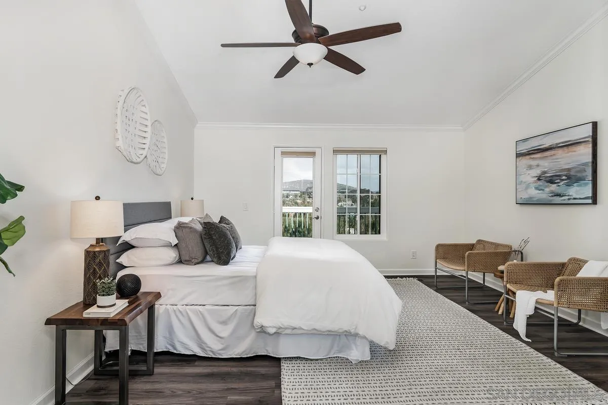 16470 Avenida Venusto, Unit F Rancho Bernardo, CA 92128 - Photo 18 of 30 a bedroom with a bed and wooden floor