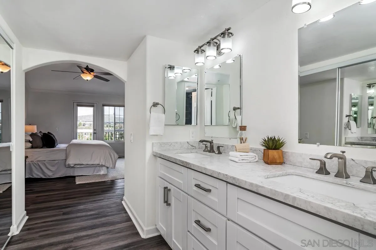 16470 Avenida Venusto, Unit F Rancho Bernardo, CA 92128 - Photo 20 of 30 a en suite bathroom with double sink and a mirror