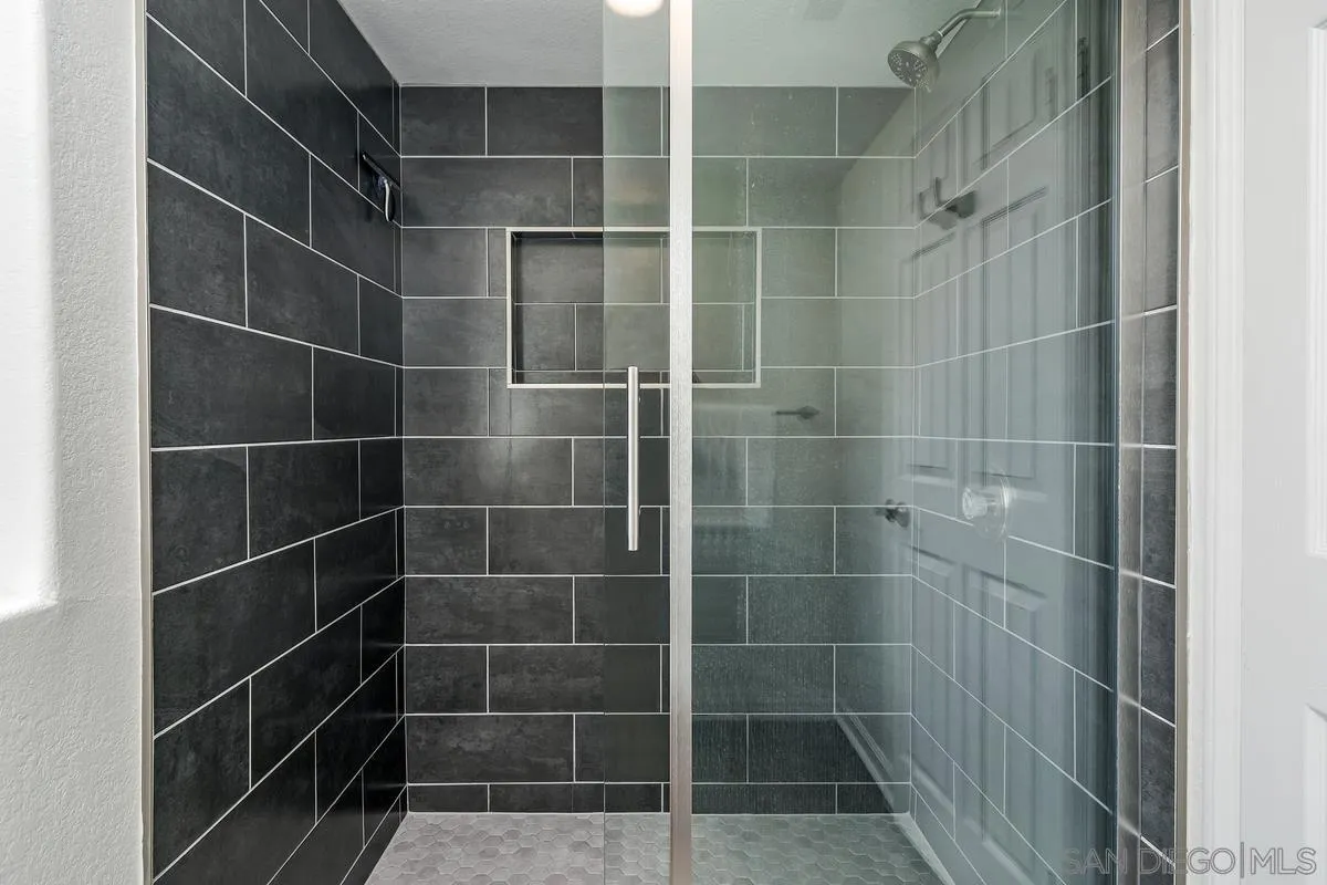 16470 Avenida Venusto, Unit F Rancho Bernardo, CA 92128 - Photo 22 of 30 a bathroom with a shower