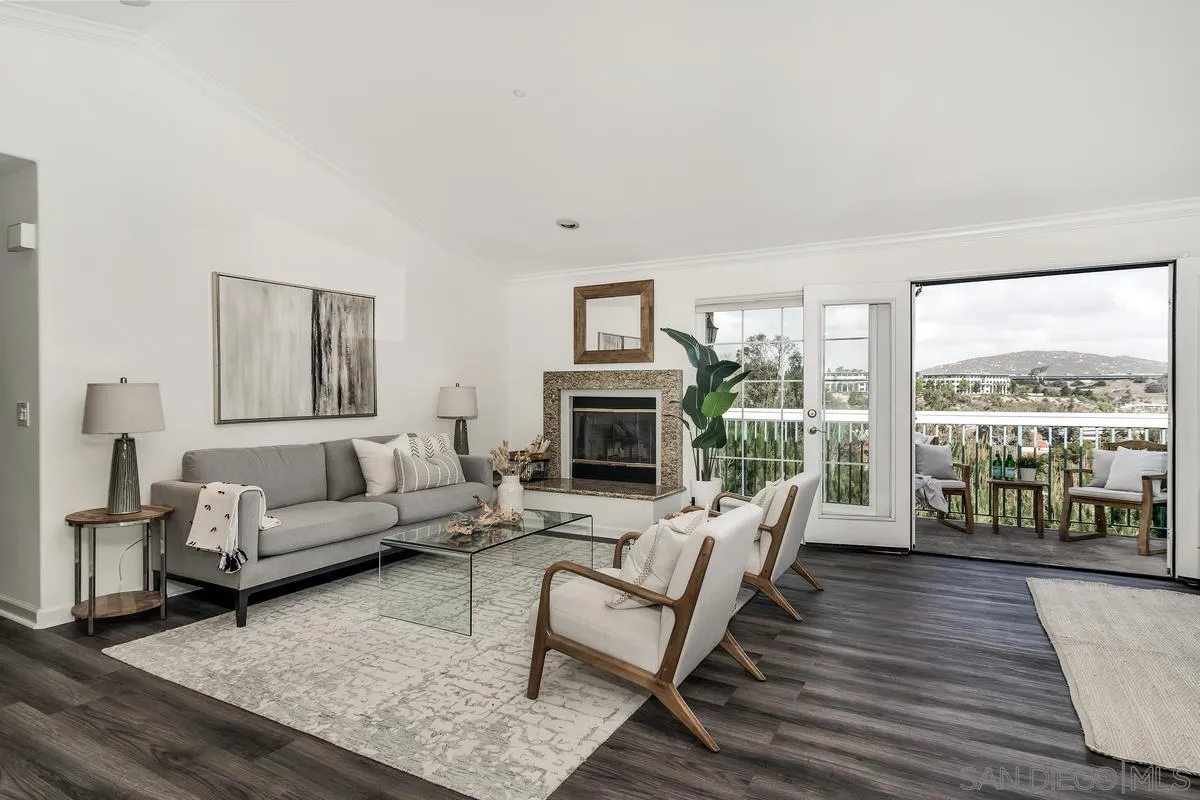 16470 Avenida Venusto, Unit F Rancho Bernardo, CA 92128 - Photo 4 of 30 a living room with furniture large window and wooden floor