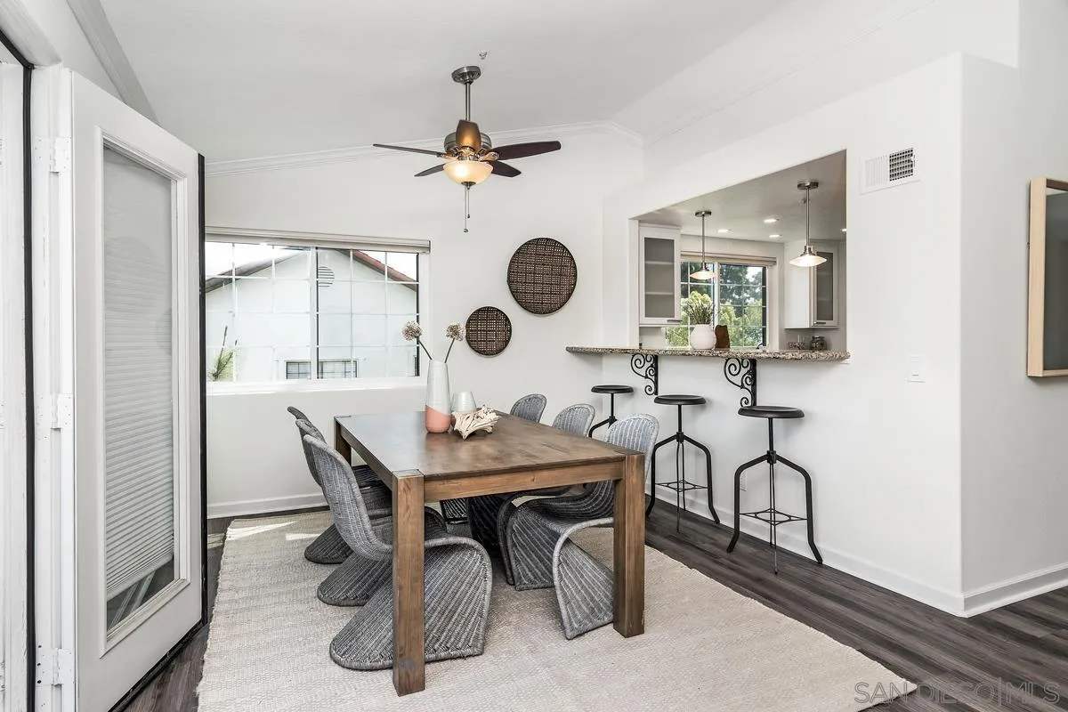 16470 Avenida Venusto, Unit F Rancho Bernardo, CA 92128 - Photo 7 of 30 a view of a dining room and a table and chairs