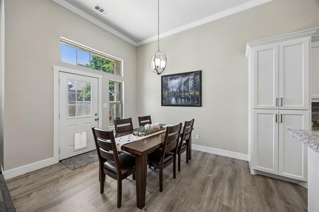 612 Frisco Road Sherman, TX 75090 - Photo 21 of 25 Dining area with wood-finish flooring, high ceilings, and crown molding