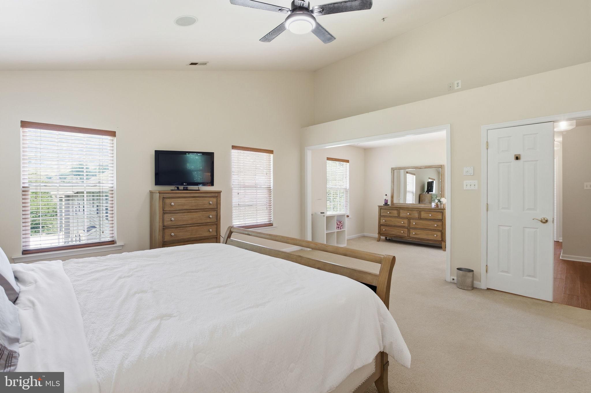 800 Rustic Court Perryville, MD 21903 - Photo 28 of 35 a spacious bedroom with a bed and a flat screen tv
