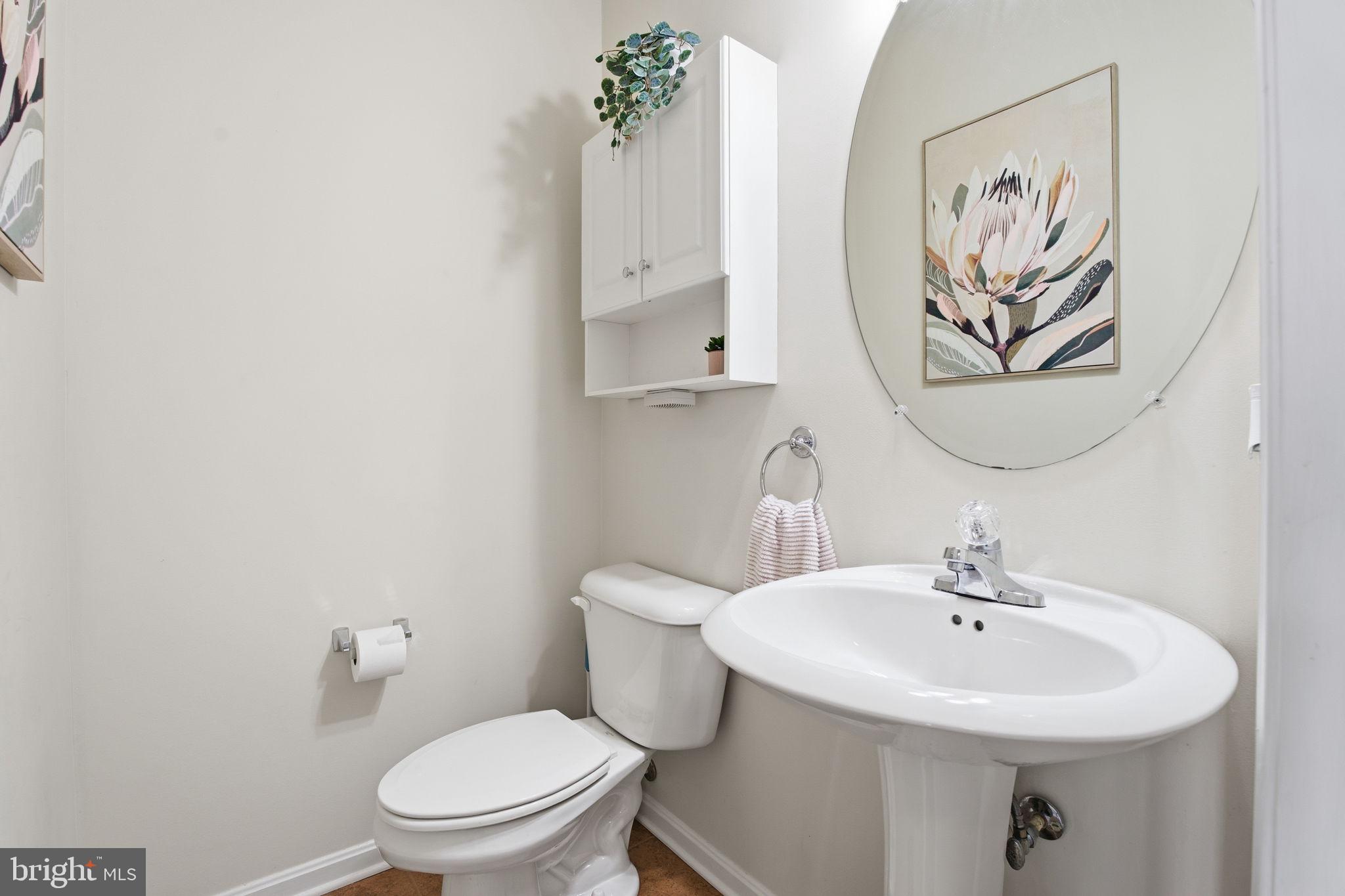 800 Rustic Court Perryville, MD 21903 - Photo 7 of 35 a bathroom with a toilet a sink and mirror