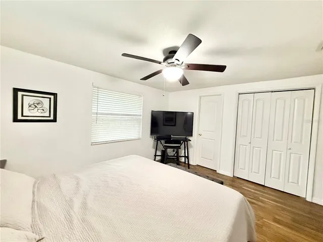 a bathroom with a toilet a sink and a mirror