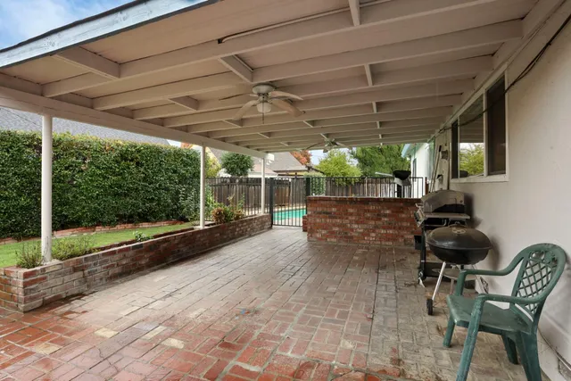 a view of a chairs and table in the patio