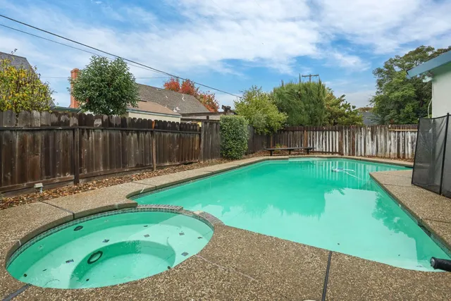 a view of a backyard with a small pool