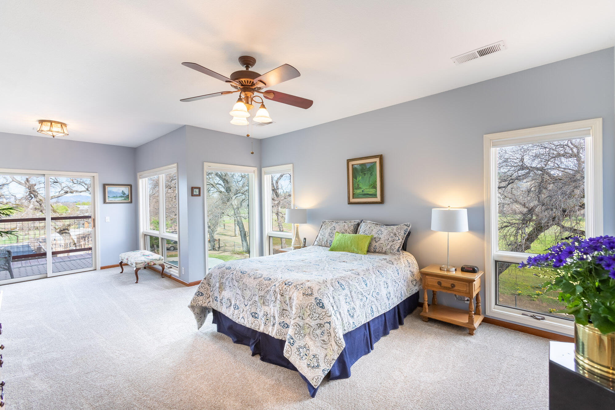 23848 Springwood Way Millville, CA 96062 - Photo 30 of 99 a bedroom with a bed and a chandelier