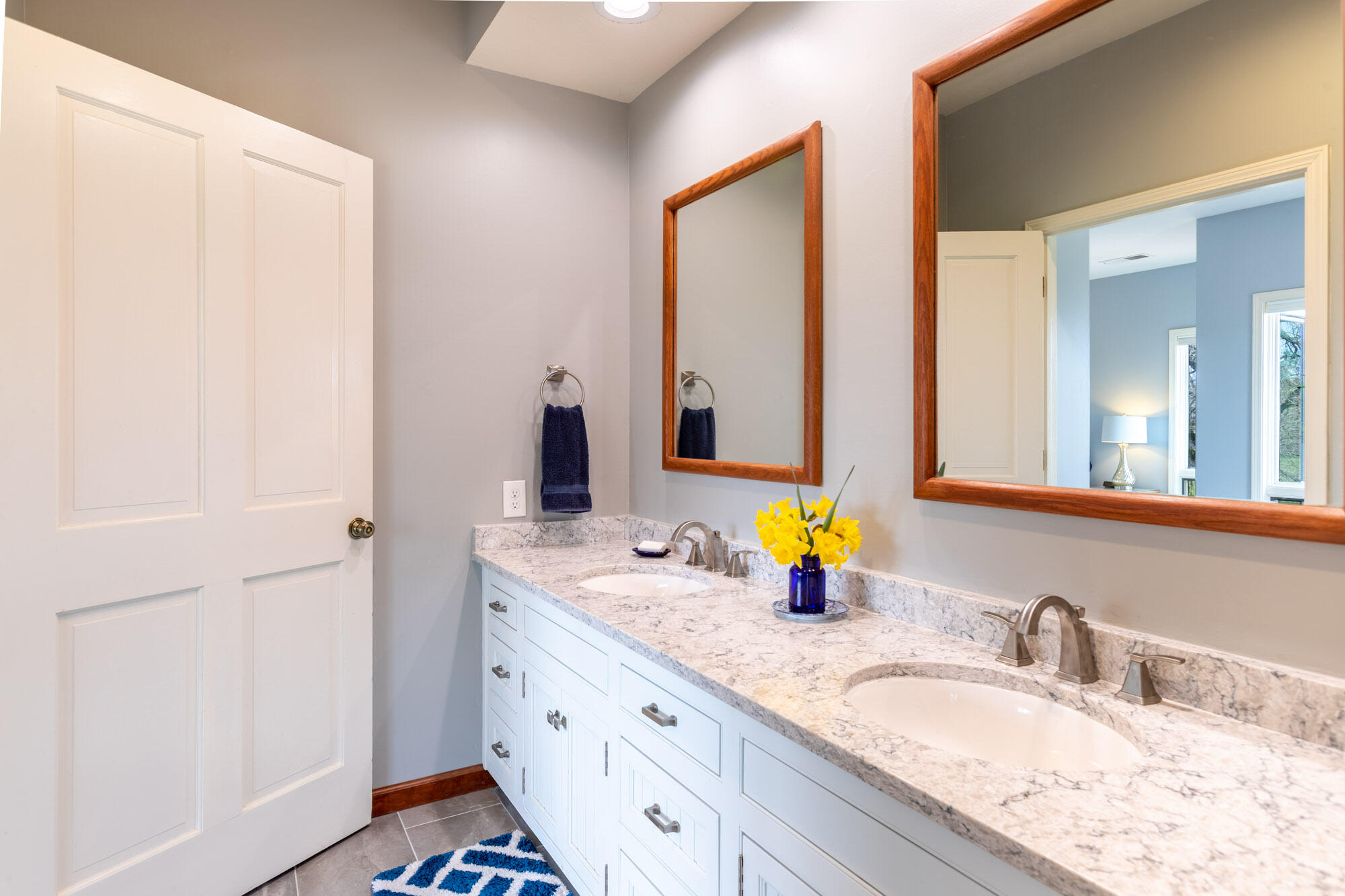 23848 Springwood Way Millville, CA 96062 - Photo 33 of 99 a bathroom with double vanity sinks and a mirror