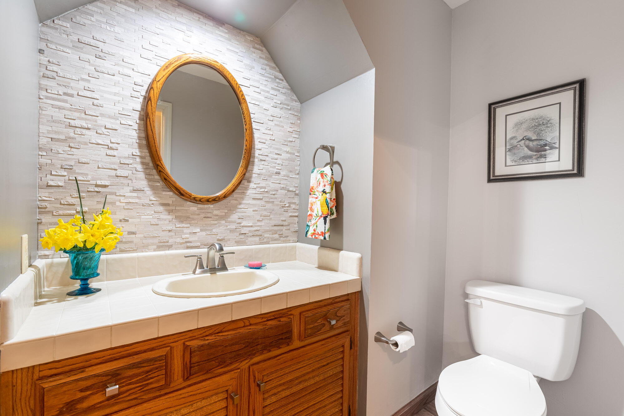 23848 Springwood Way Millville, CA 96062 - Photo 37 of 99 a bathroom with a toilet a sink and a mirror