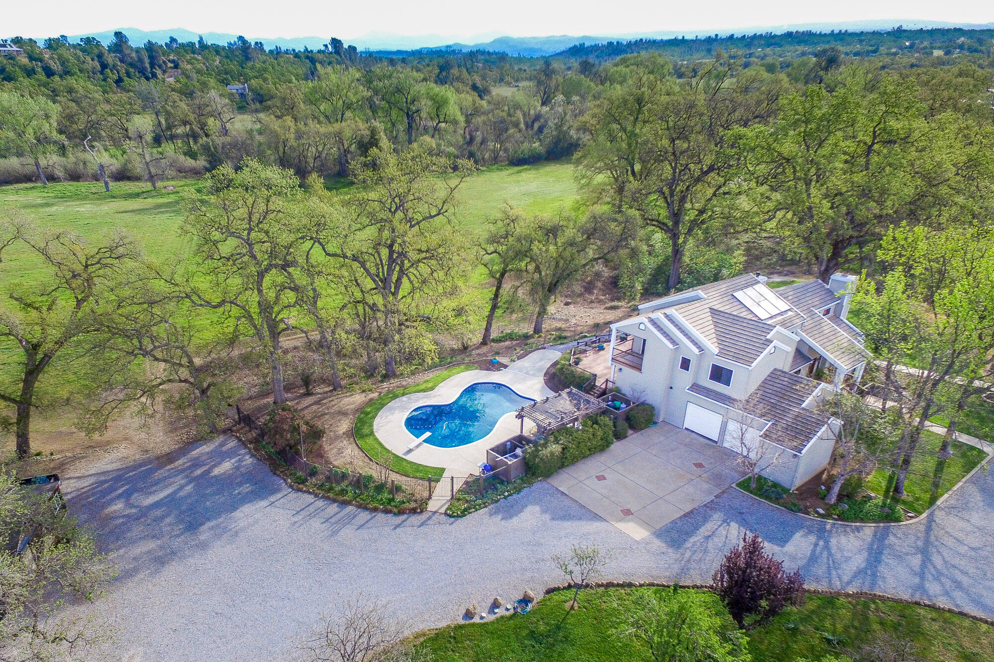 23848 Springwood Way Millville, CA 96062 - Photo 4 of 99 an aerial view of a house with a yard