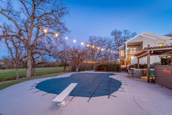 a front view of a building with garden