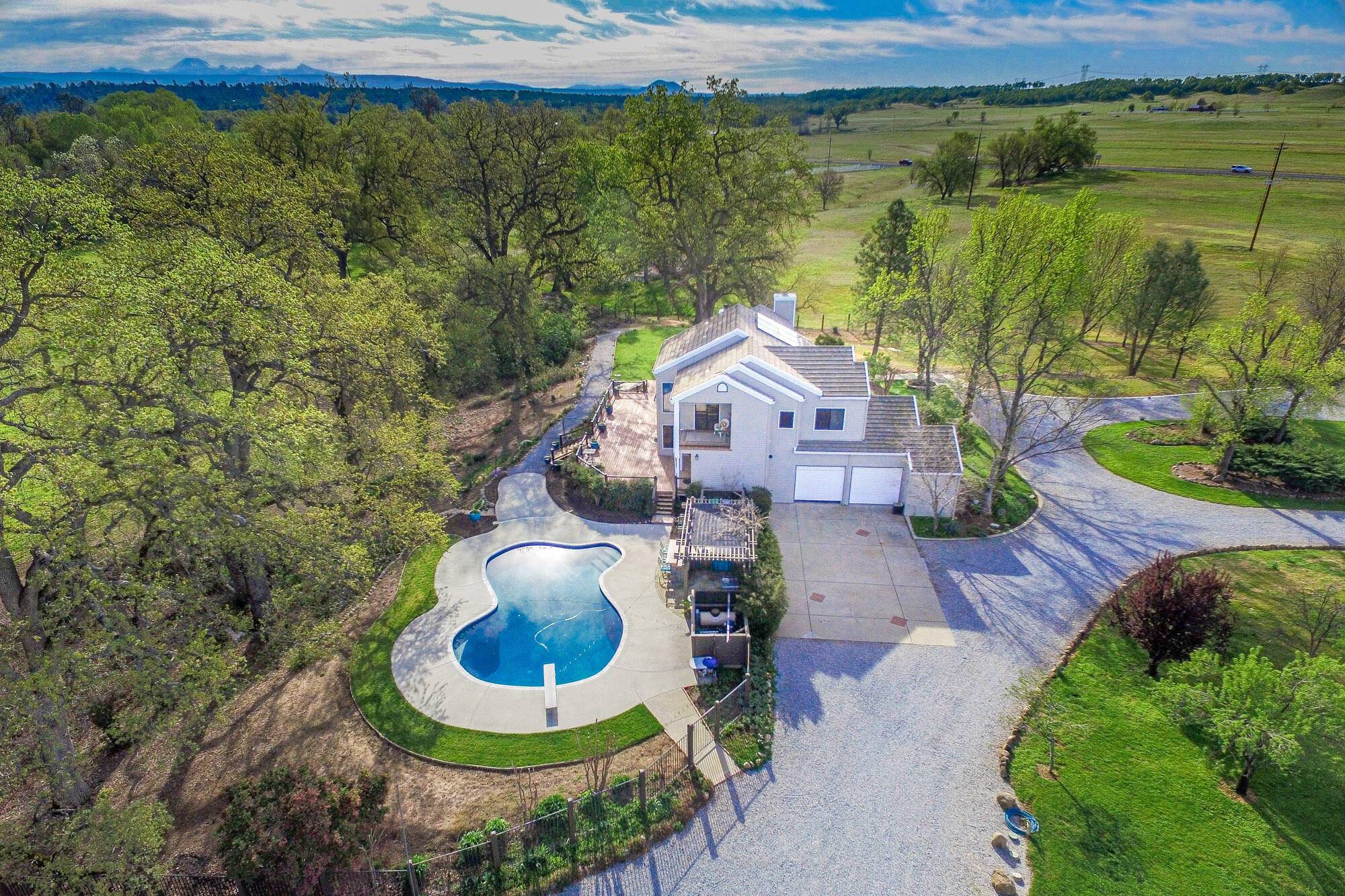 23848 Springwood Way Millville, CA 96062 - Photo 44 of 99 an aerial view of a house with garden space and a lake view