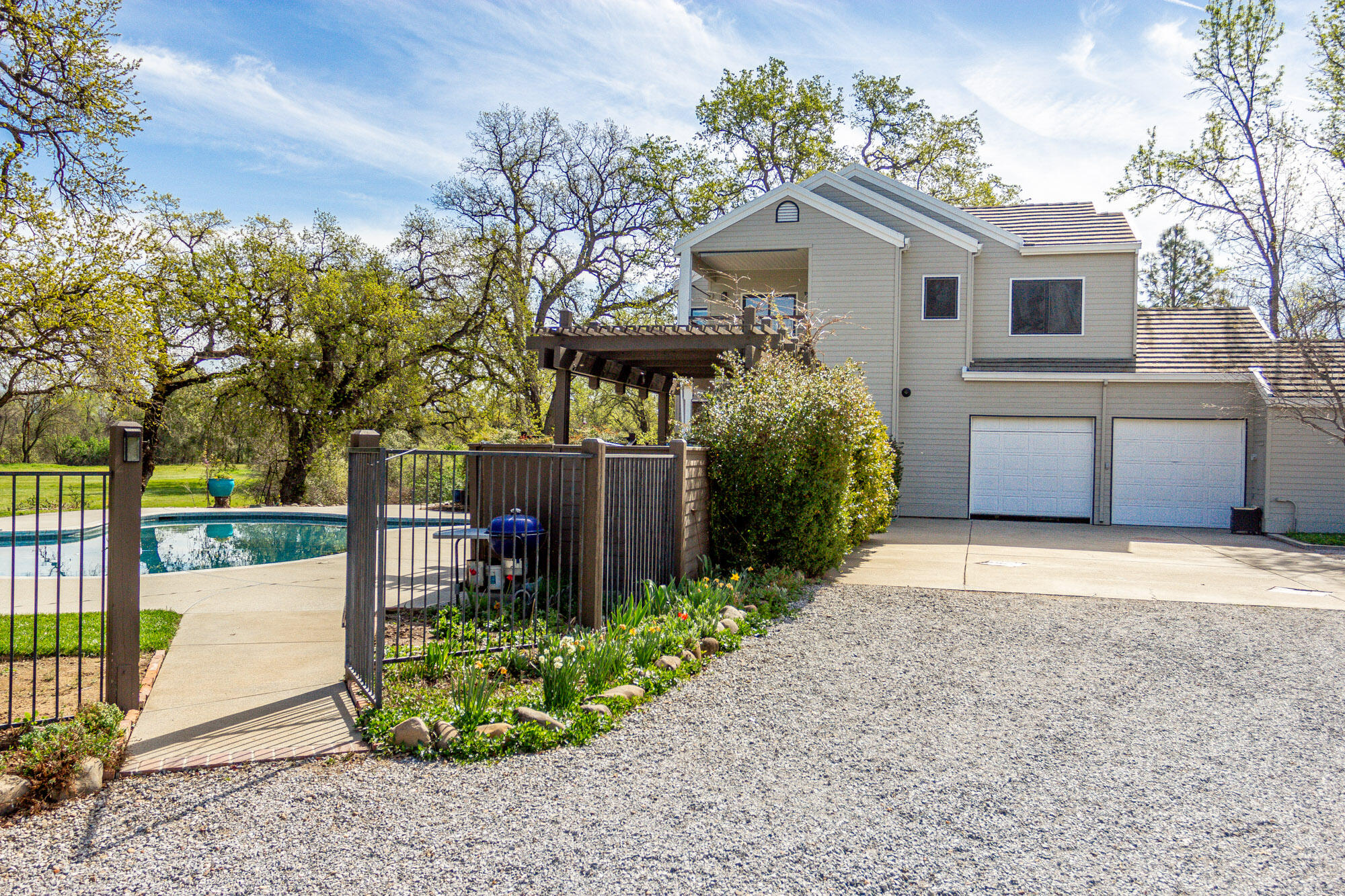 23848 Springwood Way Millville, CA 96062 - Photo 45 of 99 a front view of a house with garden