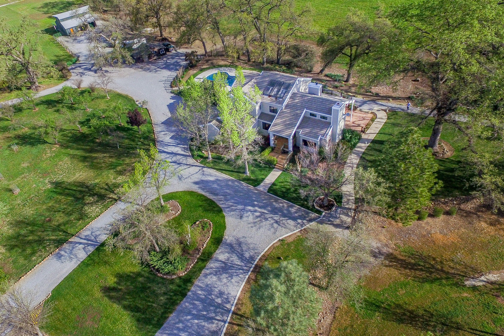 23848 Springwood Way Millville, CA 96062 - Photo 47 of 99 an aerial view of a house with a yard and greenery