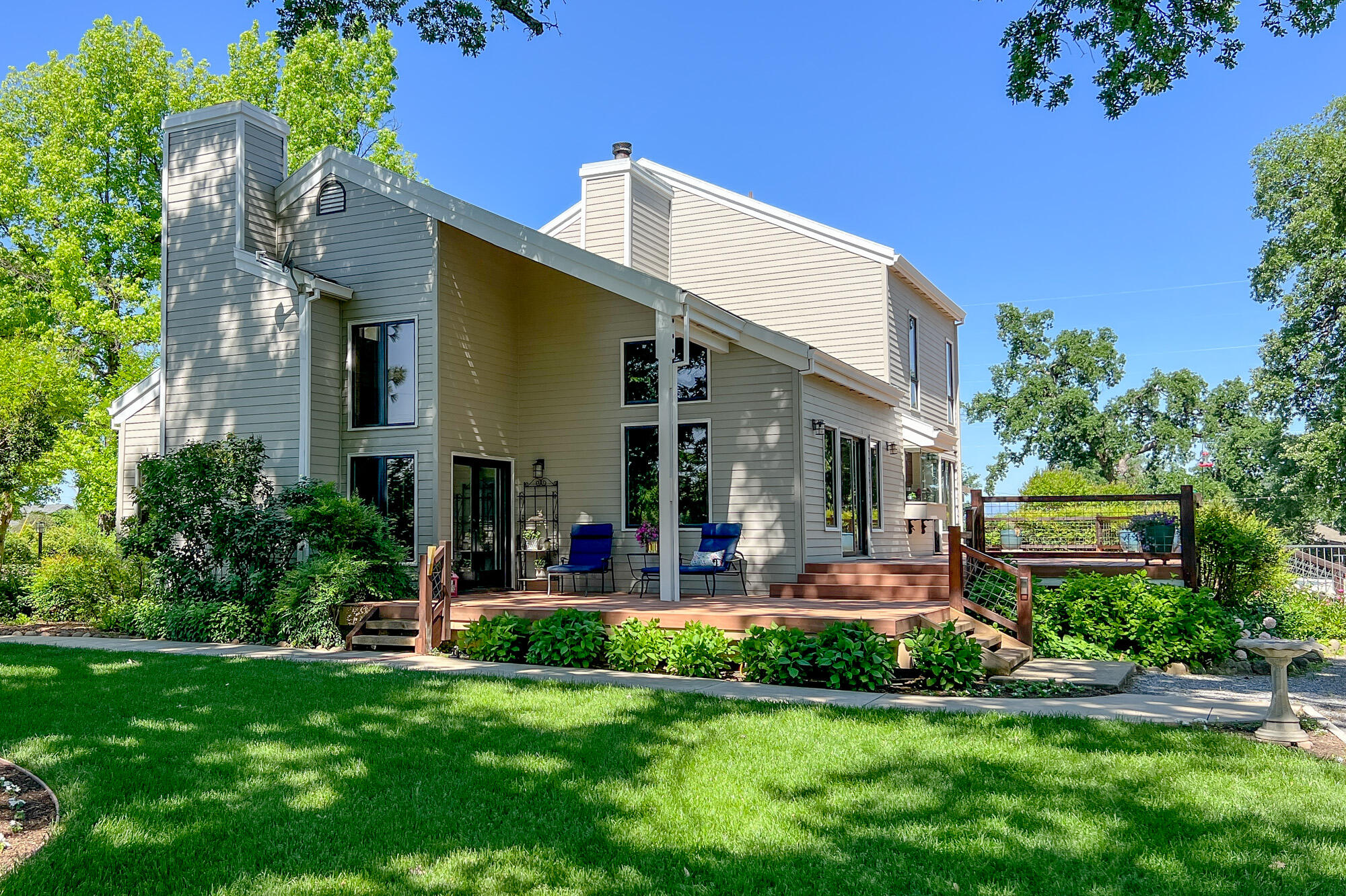 23848 Springwood Way Millville, CA 96062 - Photo 97 of 99 a front view of a house with swimming pool and garden