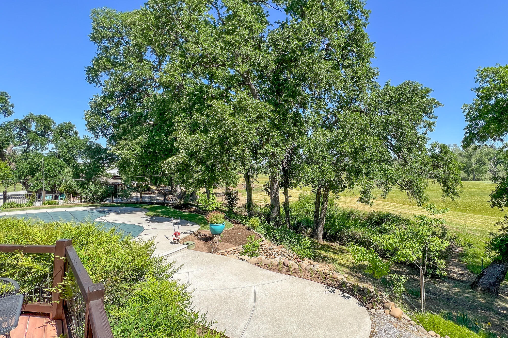 23848 Springwood Way Millville, CA 96062 - Photo 98 of 99 a backyard of a house with a yard and trampoline