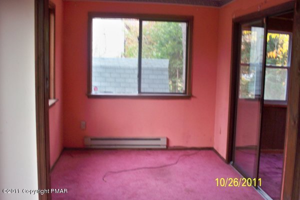 701 Edgewood Road Tobyhanna, PA 18466 - Photo 4 of 8 a view of an empty room with a window