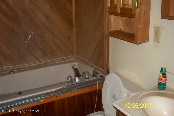 701 Edgewood Road Tobyhanna, PA 18466 - Photo 6 of 8 a bathroom with a sink and a mirror