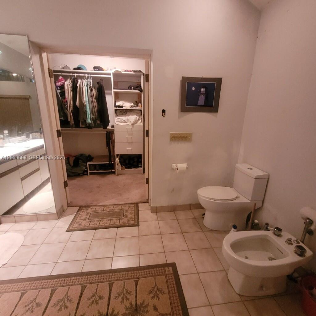 8339 Southwest 112th Street Miami, FL 33156 - Photo 18 of 30 a bathroom with a toilet and a shower