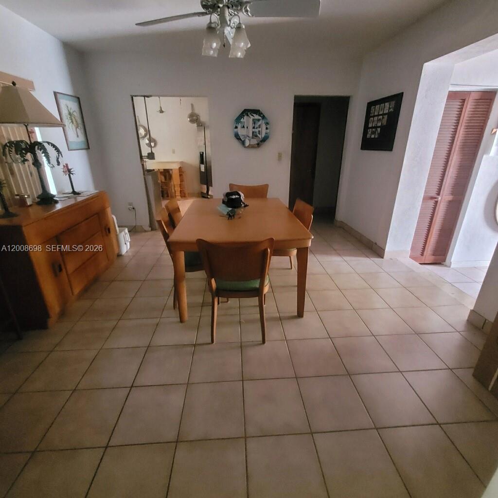 8339 Southwest 112th Street Miami, FL 33156 - Photo 19 of 30 a view of a dining room with furniture