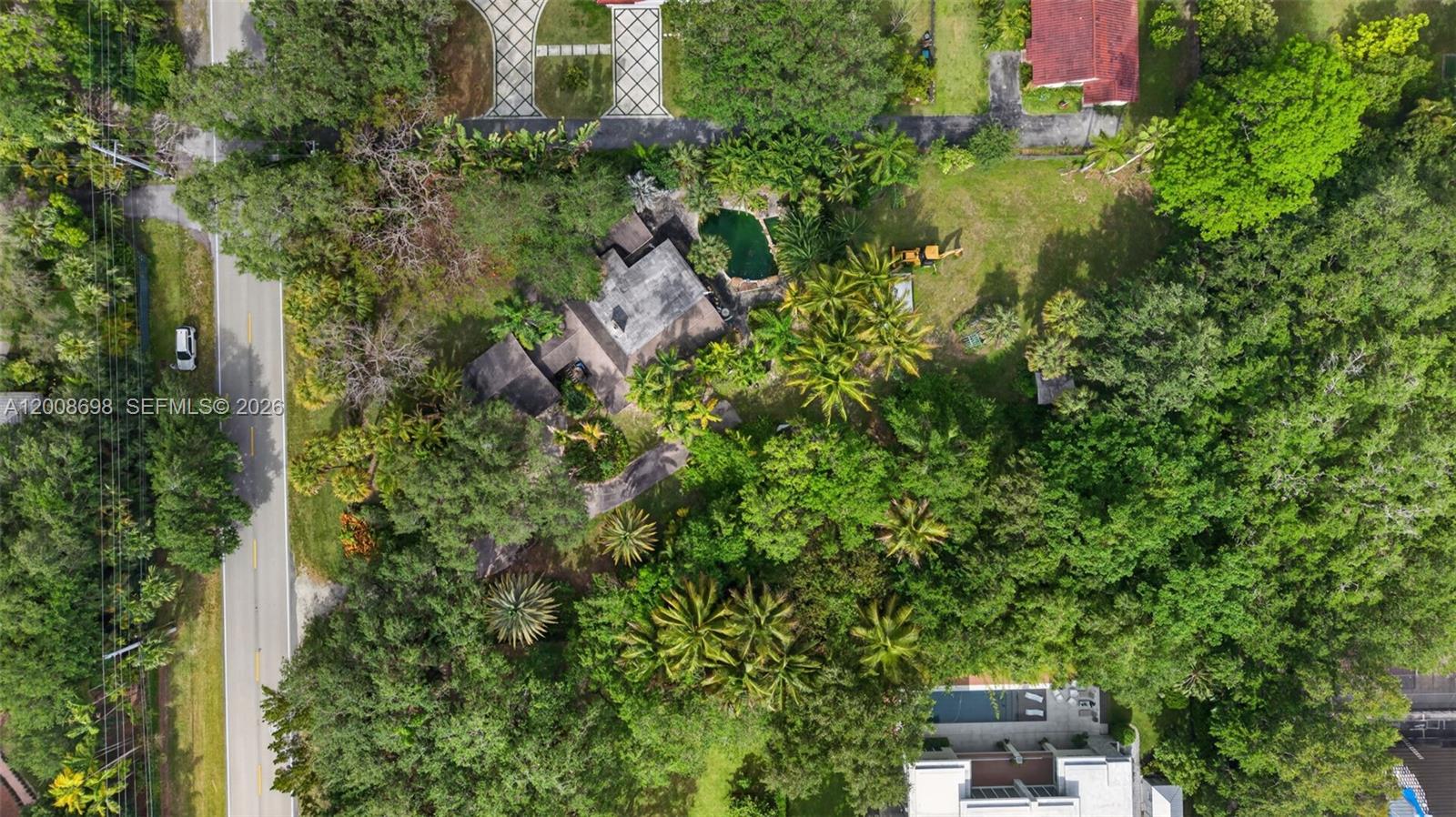 8339 Southwest 112th Street Miami, FL 33156 - Photo 2 of 30 an aerial view of a house with a yard
