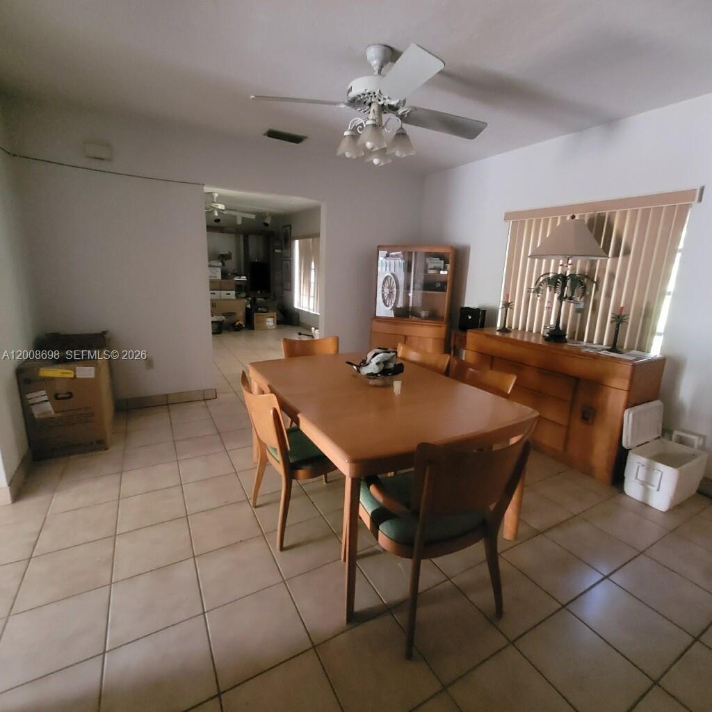 8339 Southwest 112th Street Miami, FL 33156 - Photo 21 of 30 a view of a dining room with furniture