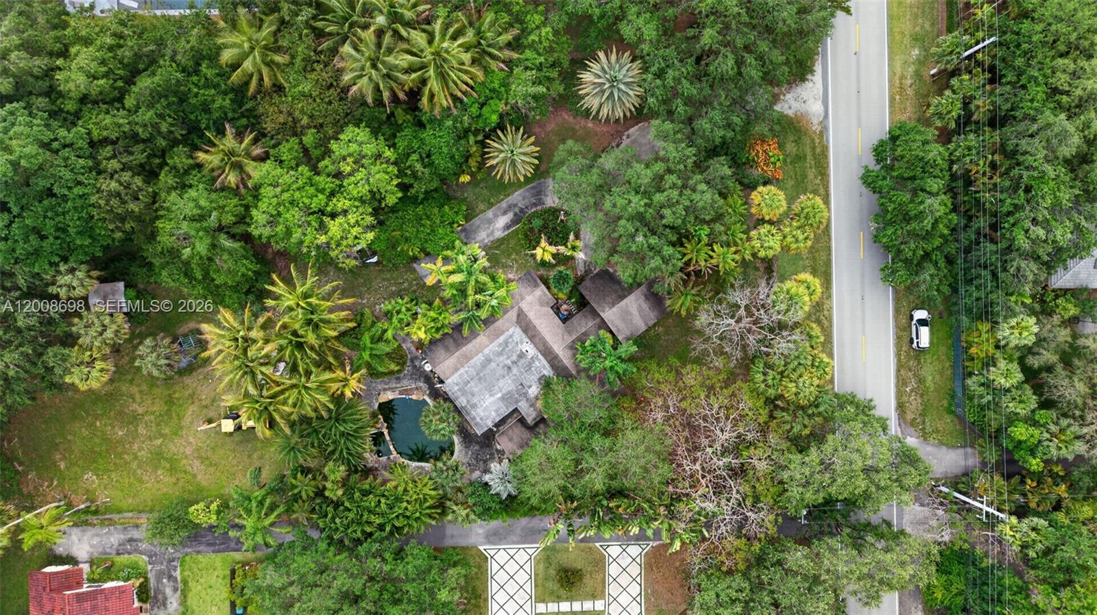 8339 Southwest 112th Street Miami, FL 33156 - Photo 3 of 30 an aerial view of residential house with outdoor space and trees all around