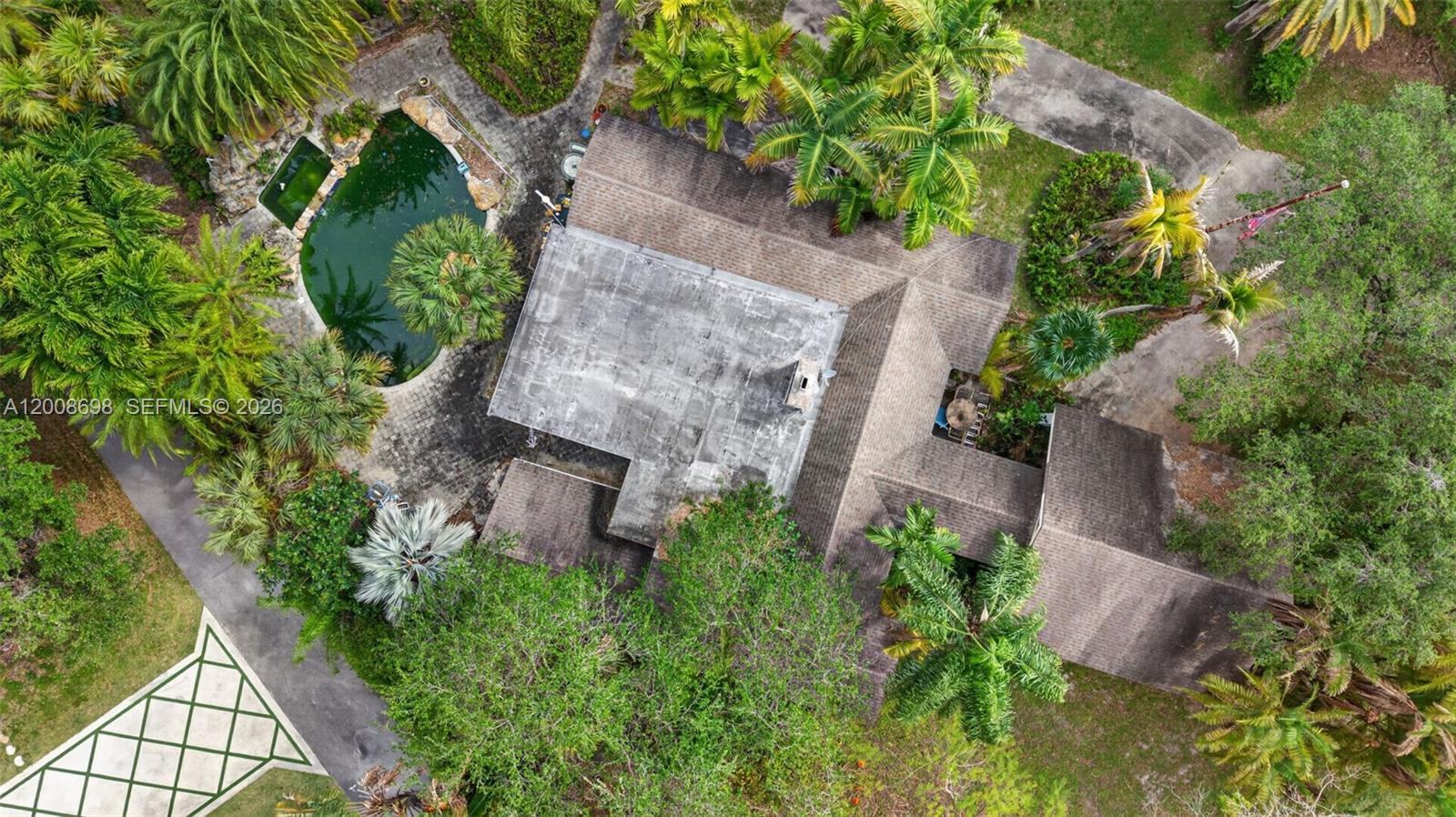 8339 Southwest 112th Street Miami, FL 33156 - Photo 5 of 30 an aerial view of a house with garden space and street view