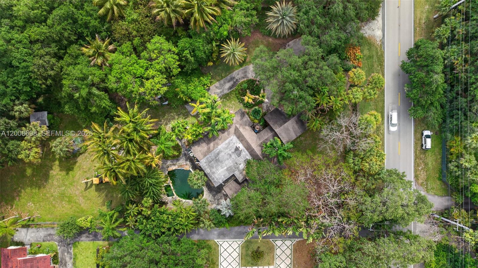 8339 Southwest 112th Street Miami, FL 33156 - Photo 6 of 30 an aerial view of residential house with outdoor space and trees all around