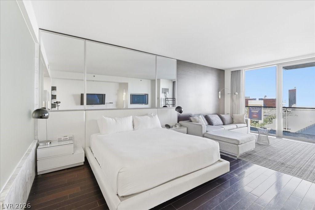 4381 West Flamingo Road, Unit 10306 Las Vegas, NV 89103 - Photo 6 of 26 This spacious bedroom features ample natural light and direct outdoor access.