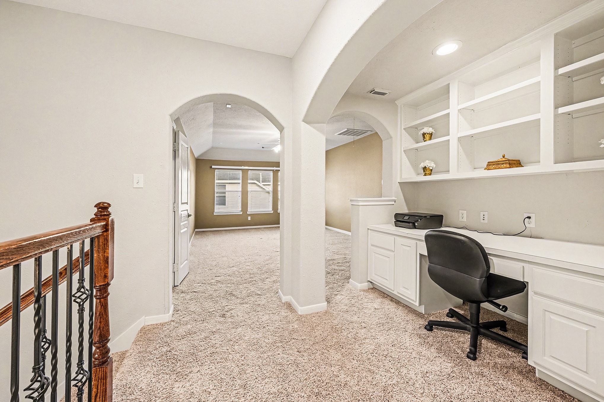 4402 Eden Point Lane Katy, TX 77494 - Photo 23 of 39 UPSTAIRS NOOK WITH ARCHES FOR OFFICE SPACE, PLACE FOR THE KIDS TO STUDY WITH AMPLE SHELFING AND STORAGE WHICH OPENS TO GAMEROOM.