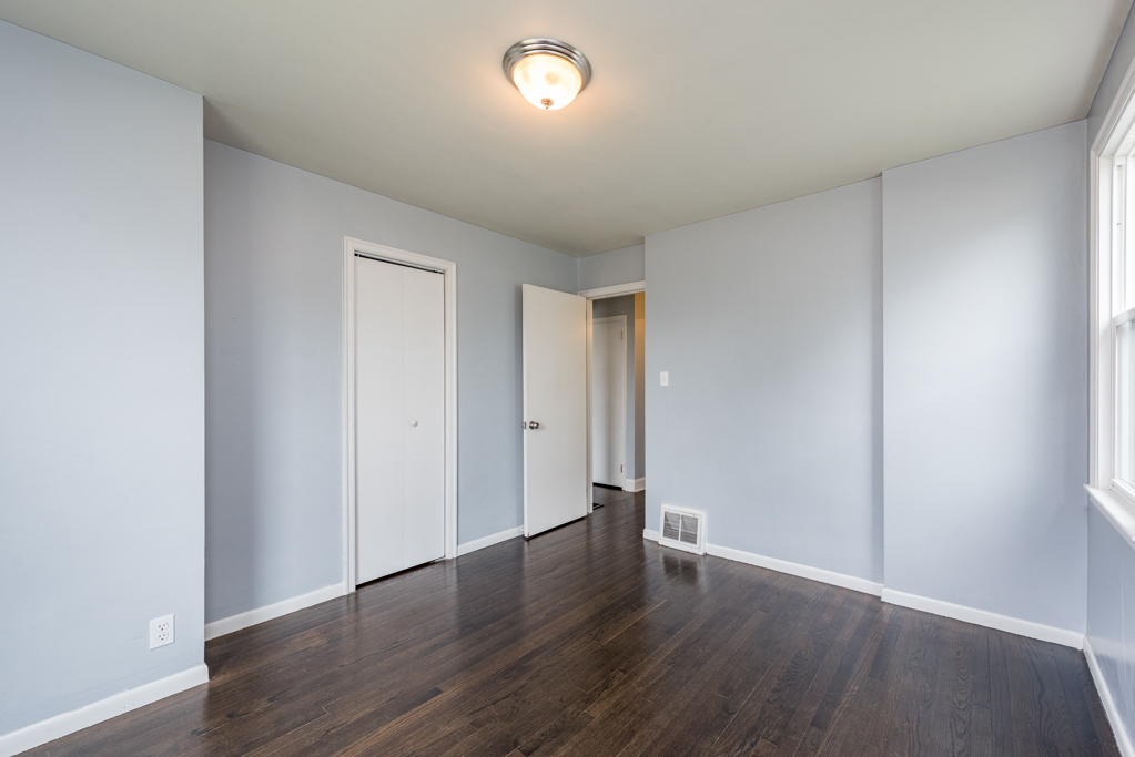 1111 Jones Avenue Racine, WI 53402 - Photo 12 of 27 a big room with wooden floor and windows
