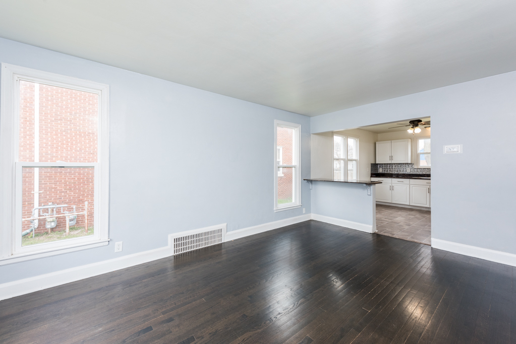 1111 Jones Avenue Racine, WI 53402 - Photo 3 of 27 an empty room with wooden floor and windows