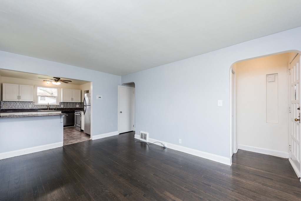 1111 Jones Avenue Racine, WI 53402 - Photo 4 of 27 a view of a kitchen with wooden floor and a sink