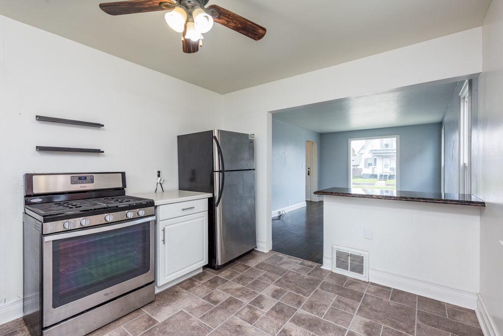 1111 Jones Avenue Racine, WI 53402 - Photo 9 of 27 a kitchen with a stove and a refrigerator