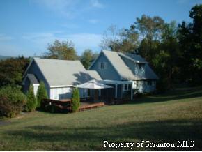 183 Sullivan - Rt Trail, Unit 92516 West Pittston, PA 18643 - Photo 2 of 5 a view of house and outdoor space