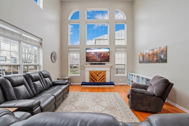 5961 Chatham Drive Hoffman Estates, IL 60192 - Photo 15 of 39 a living room with furniture ceiling fan and a window