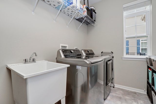 5961 Chatham Drive Hoffman Estates, IL 60192 - Photo 34 of 39 a utility room with a sink dryer and washer