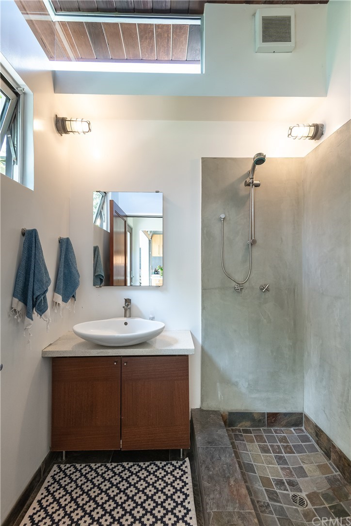 1149 Pine Avenue Manhattan Beach, CA 90266 - Photo 21 of 48 a bathroom with a sink and a mirror