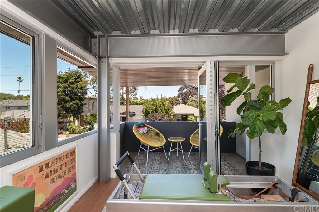 1149 Pine Avenue Manhattan Beach, CA 90266 - Photo 27 of 48 a dining room with furniture potted plants and wooden floor