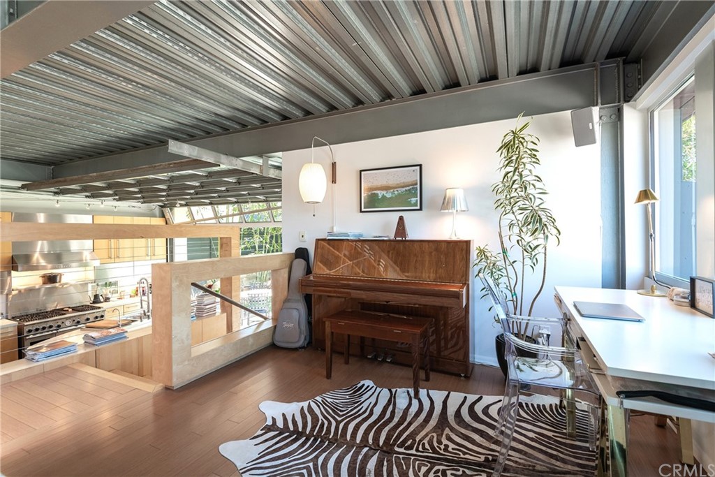 1149 Pine Avenue Manhattan Beach, CA 90266 - Photo 30 of 48 a living room with furniture a piano and a chandelier