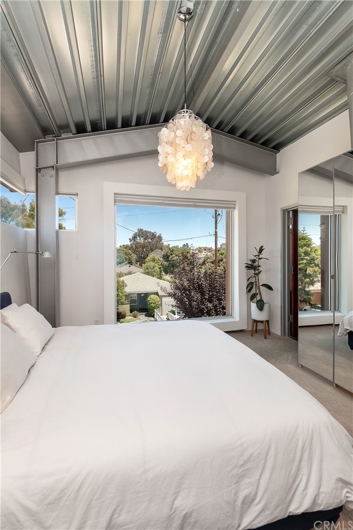 1149 Pine Avenue Manhattan Beach, CA 90266 - Photo 34 of 48 a bedroom with a bed and a large window