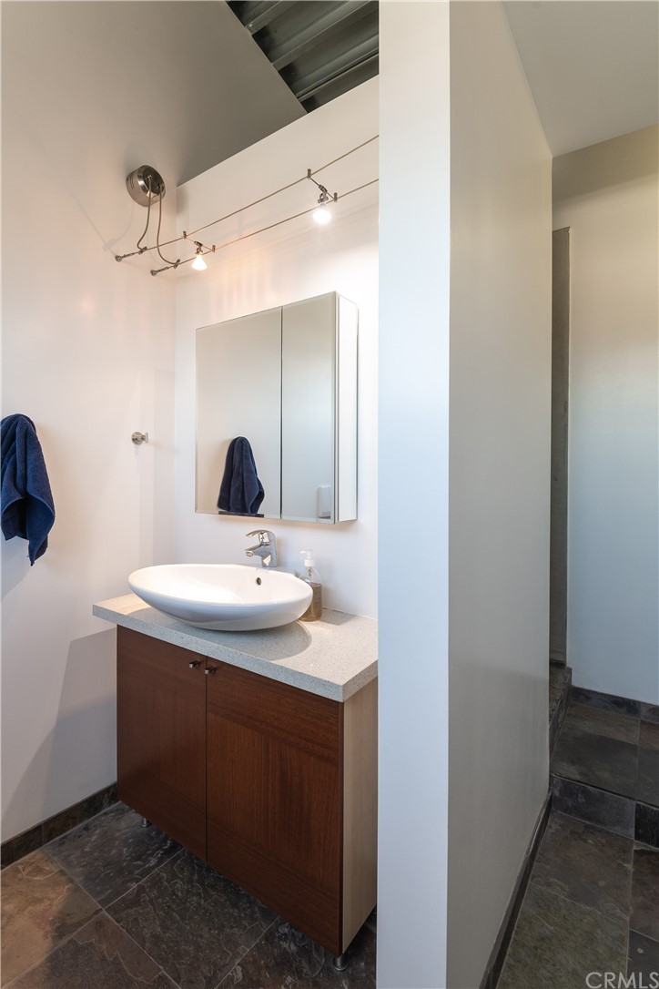 1149 Pine Avenue Manhattan Beach, CA 90266 - Photo 44 of 48 a bathroom with a sink and a mirror