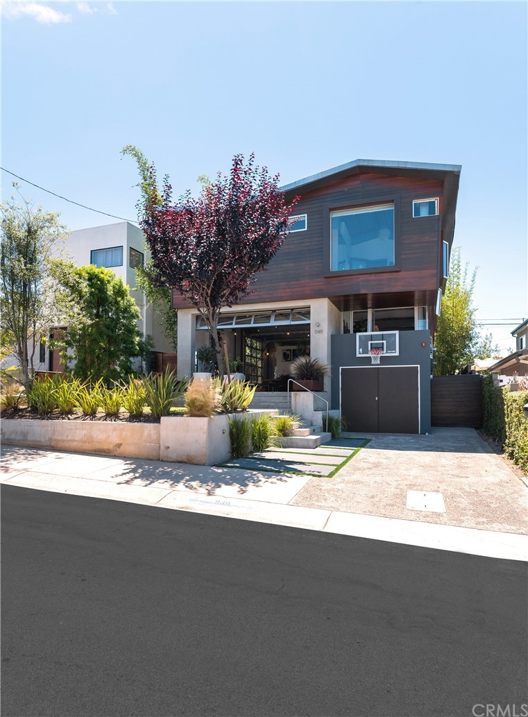 1149 Pine Avenue Manhattan Beach, CA 90266 - Photo 5 of 48 a view of a house with a patio and a yard